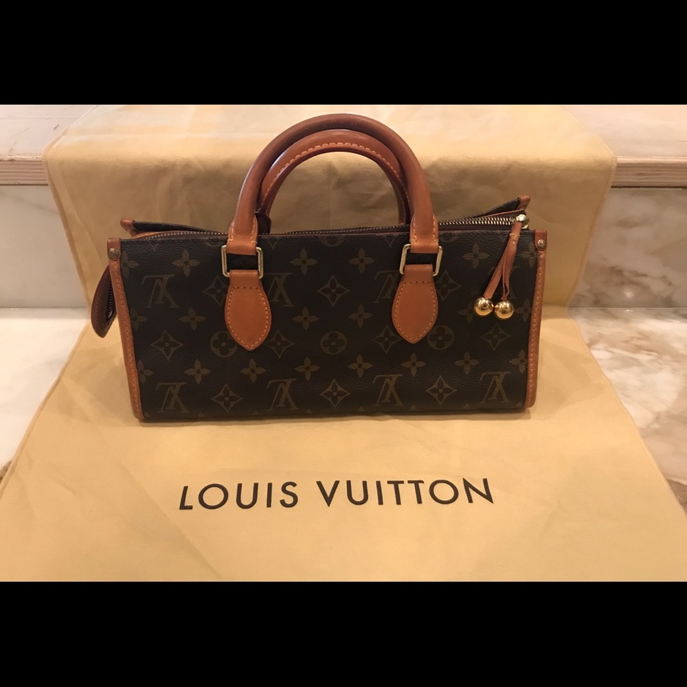With Louis Vuitton Popincourt bag